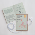 Card with 'The Great Gatsby' cover and earphones on a white background