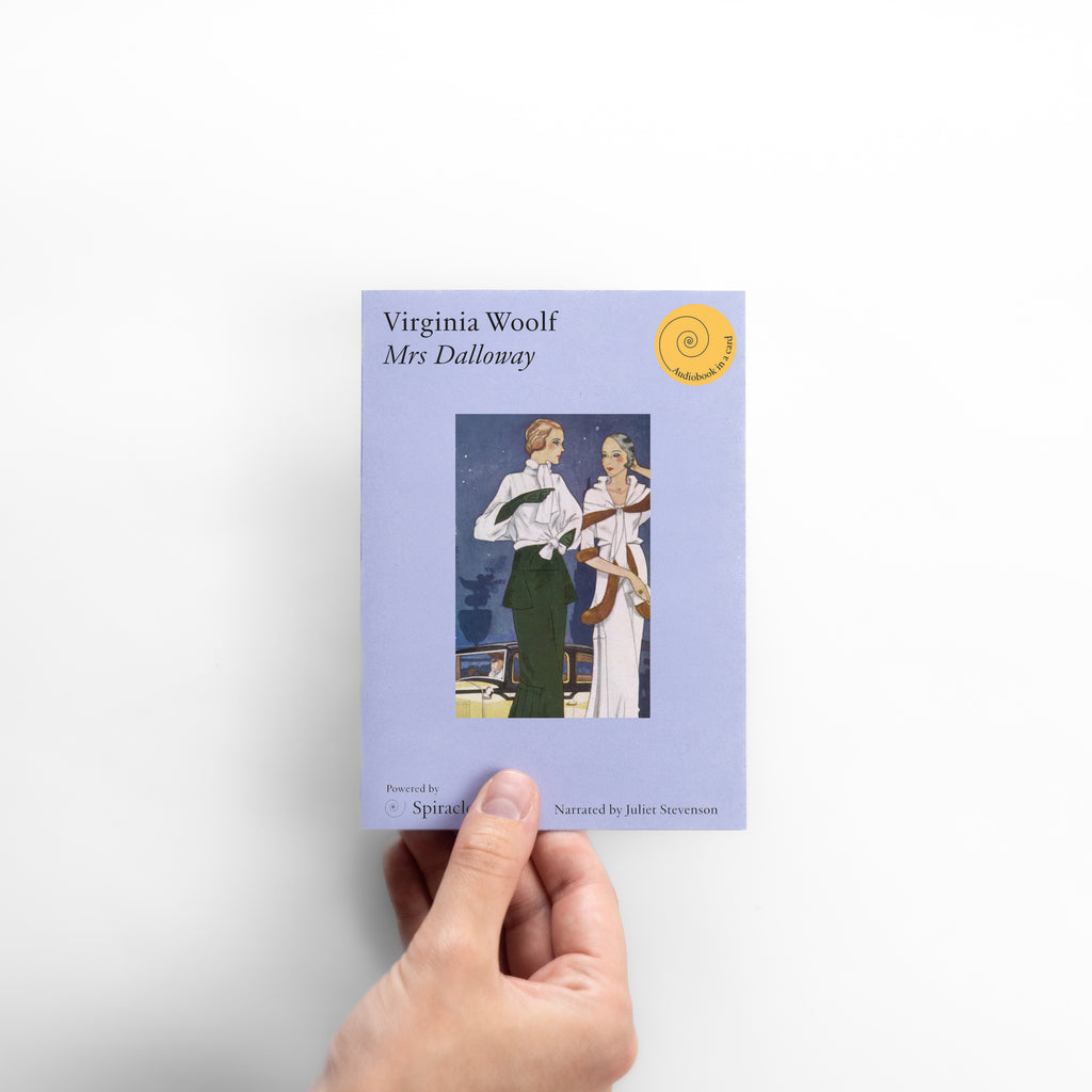 Hand holding a book titled 'Mrs Dalloway' by Virginia Woolf on a white background