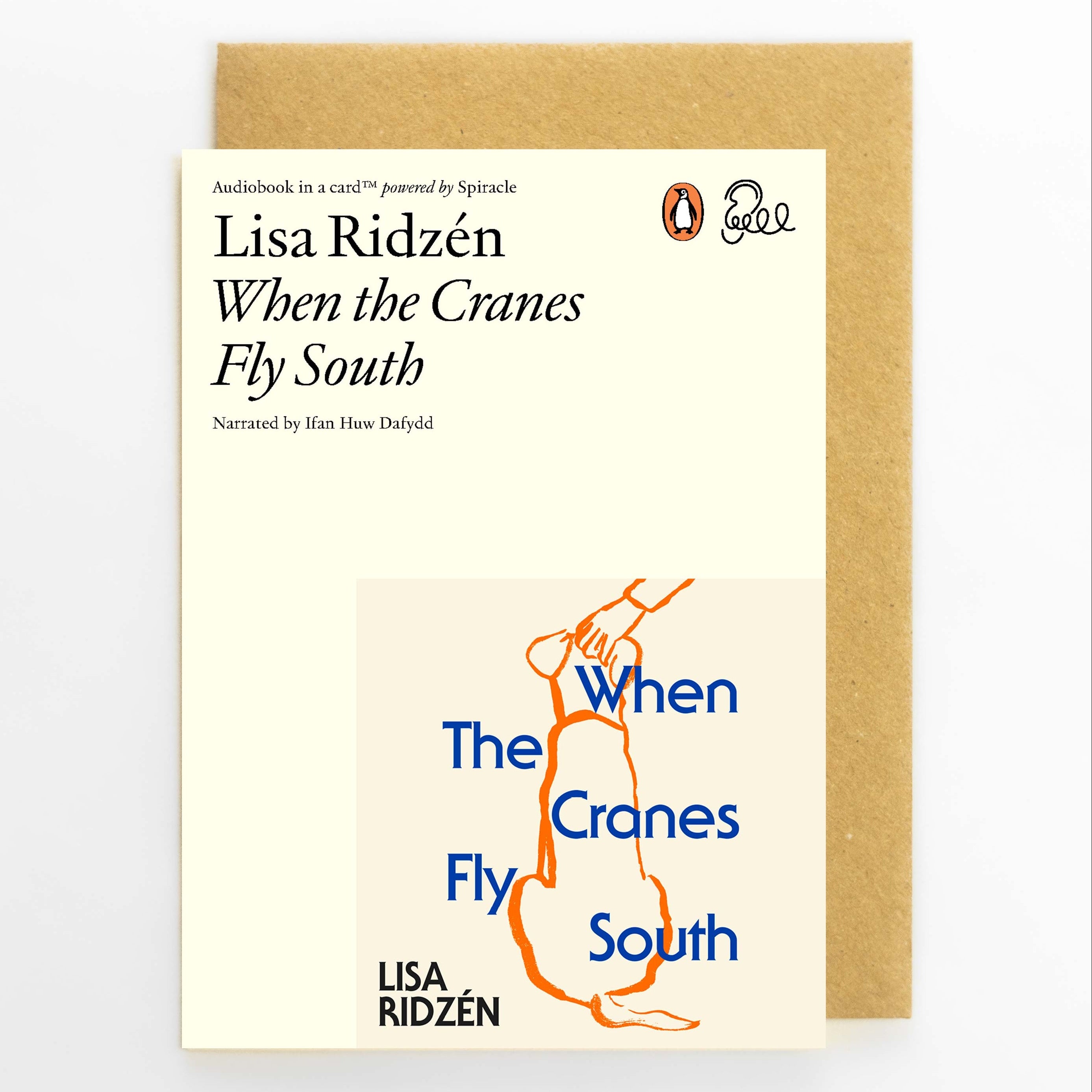 A book cover for Lisa Ridzén's audiobook 'When the Cranes Fly South' shown in front of a brown kraft envelope on a light gray background. The cover is cream-colored with black text, a blue title, and an orange abstract map graphic.