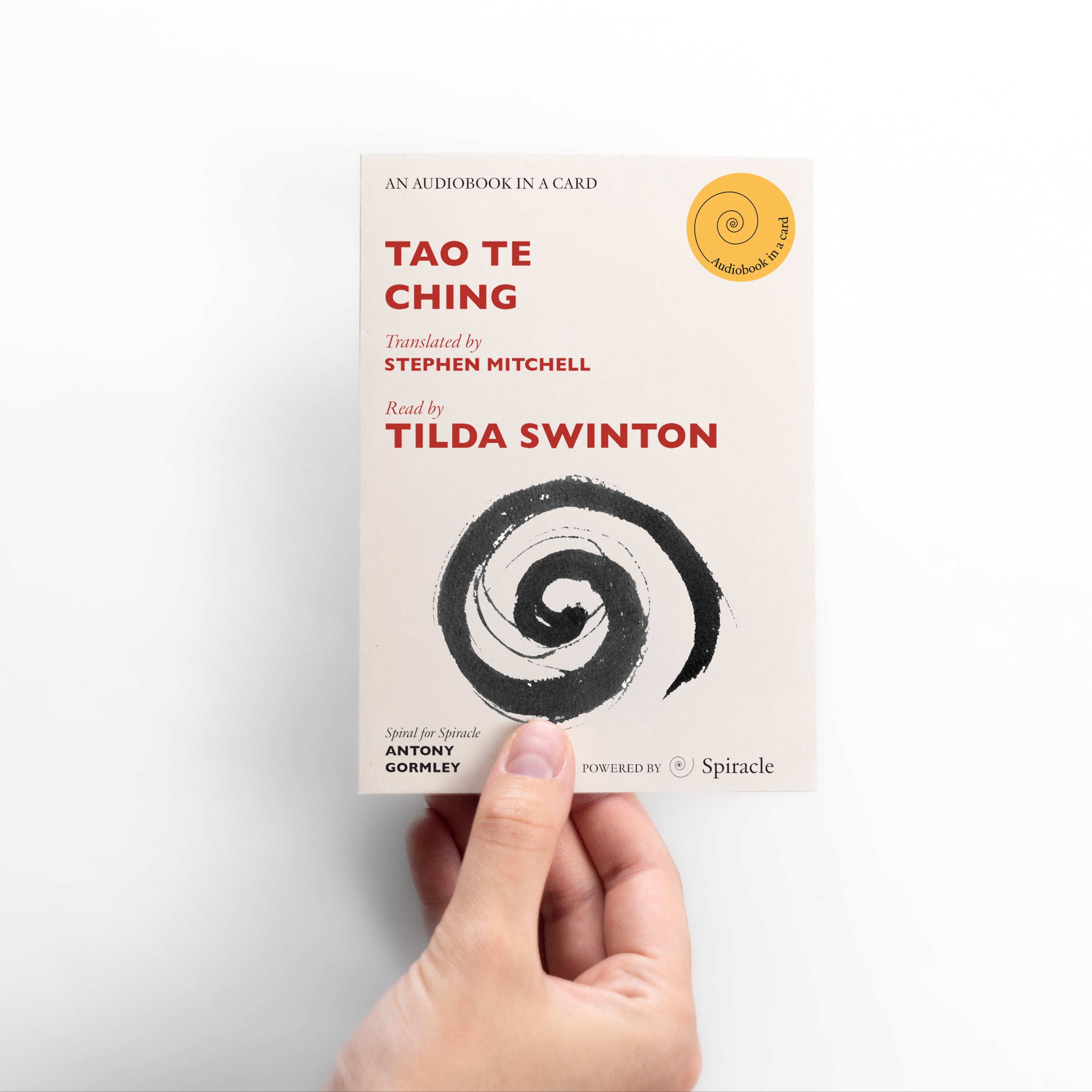 Hand holding a card with 'Tao Te Ching' audiobook information on a white background